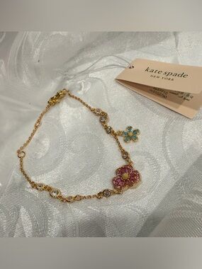 kate spade Gold Bracelet with Pink and Teal Flower Charms